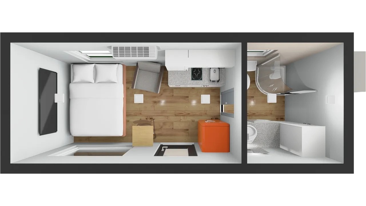 Modern container home kitchen with white cabinets and wood countertops